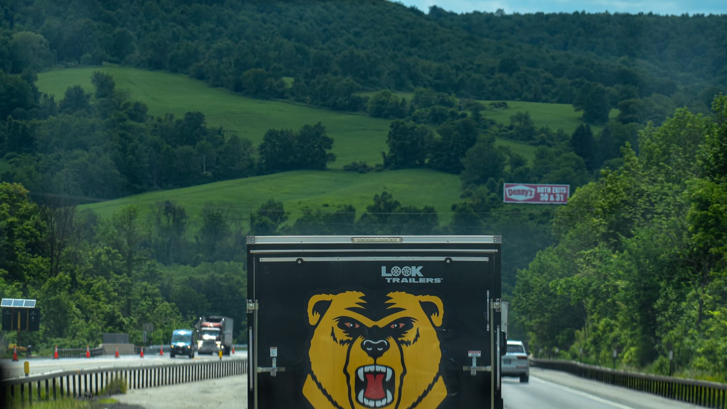 The team trailer with the Golden Bear logo on the highway heading to competition