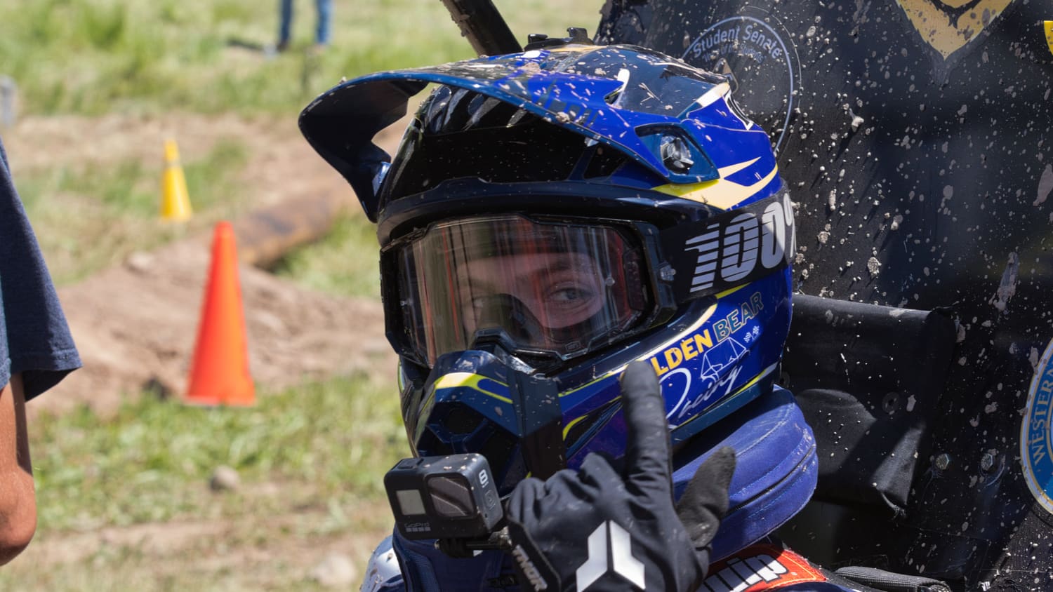 Close-up of a Golden Bear Racing driver in helmet and goggles