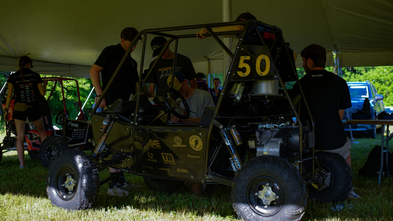GBR4 in the team tent with the crew working around it