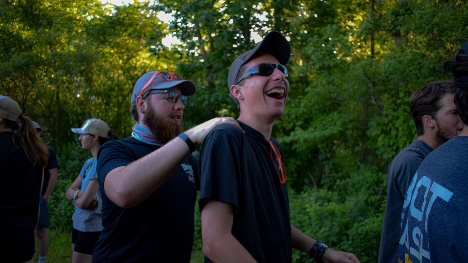 Teammates laughing together at the competition